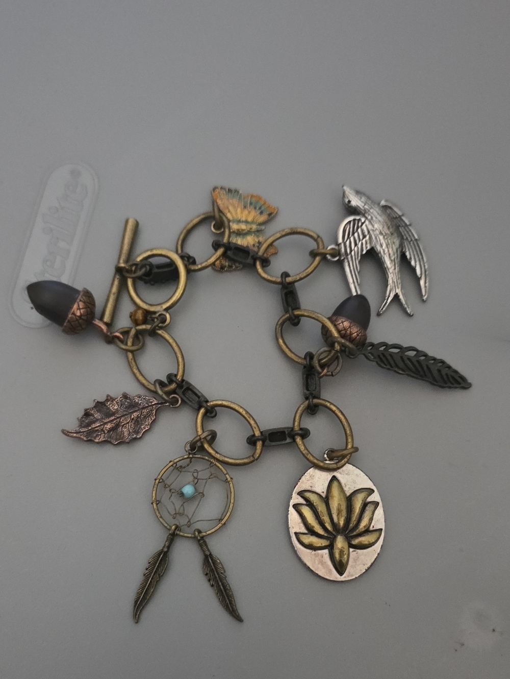 Antique Brass Charm Bracelet with Green-Toned Accents